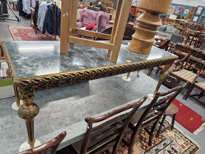 Lot 15 - A gilt decorated coffee table. H 47 W 123 D 48cm