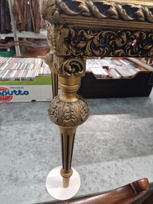 Lot 15 - A gilt decorated coffee table. H 47 W 123 D 48cm
