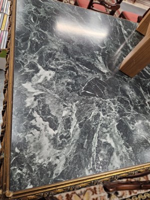 Lot 15 - A gilt decorated coffee table. H 47 W 123 D 48cm