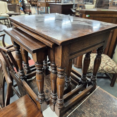 Lot 32 - A good quality nest of oak occasional tables....