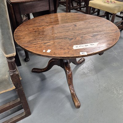 Lot 47 - An oak tripod table. H 57 W 75 D 75cm