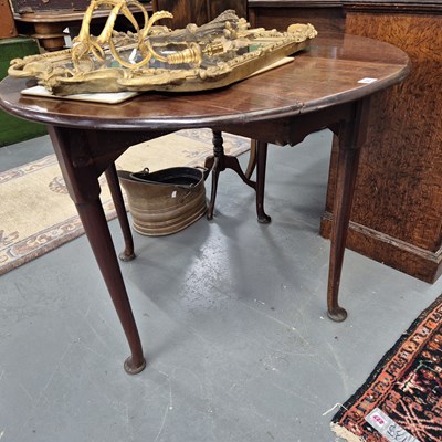 Lot 50 - A small Georgian drop leaf table. H 72 W 94 D...