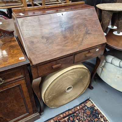 Lot 52 - A flame mahogany bureau on cabriole legs. H...