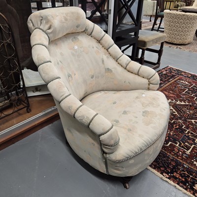 Lot 55 - A late Victorian tub armchair.