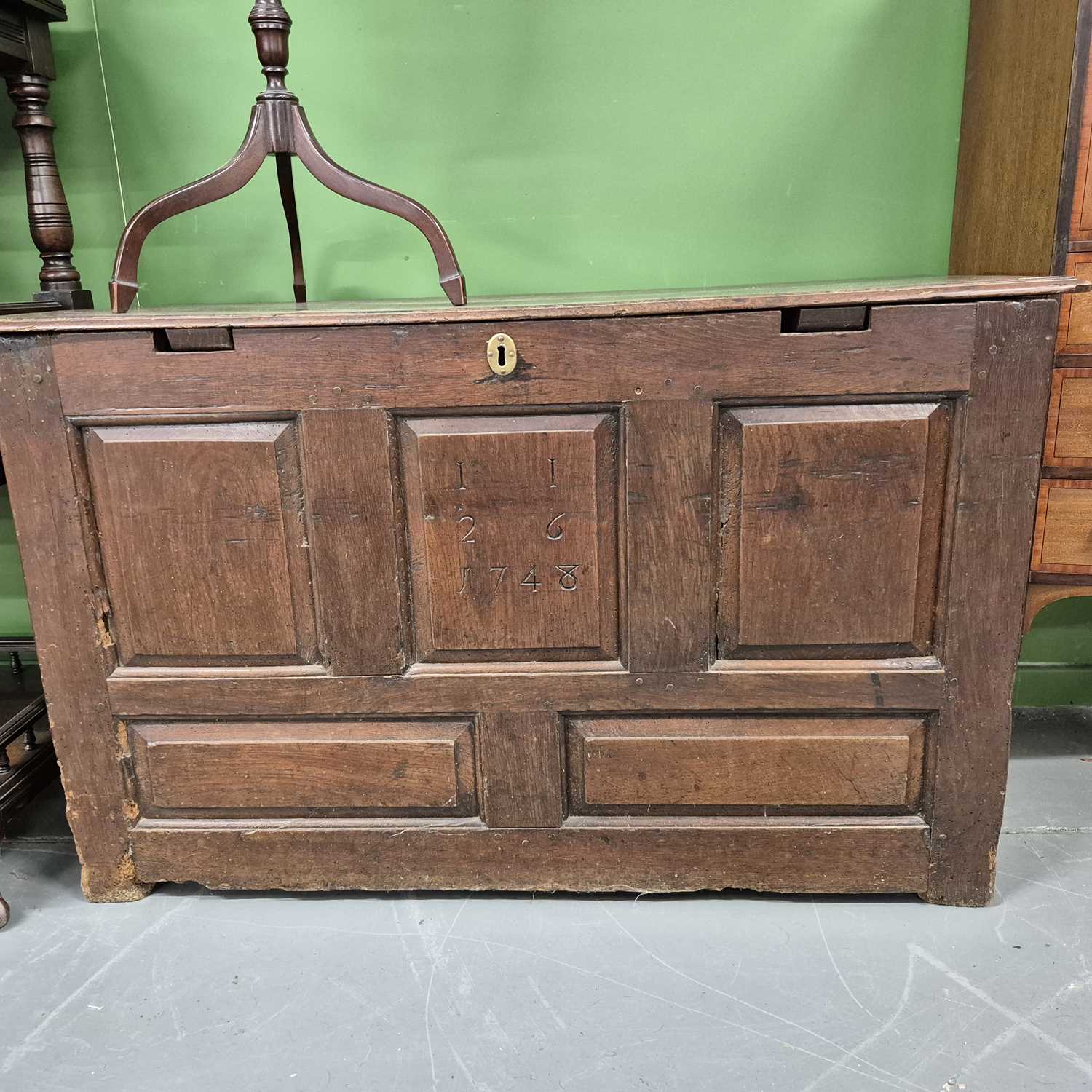 Lot 66 - An oak panel front coffer. H 72 W 114 D 52cm.