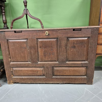 Lot 66 - An oak panel front coffer. H 72 W 114 D 52cm.