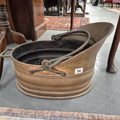 Lot 74 - A copper coal scuttle.