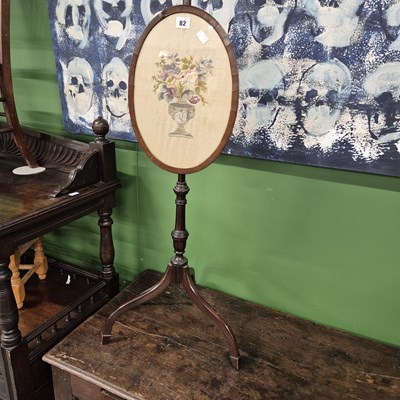 Lot 82 - A 19th century pole screen. H 131cm.