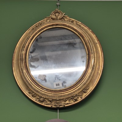 Lot 86 - A Victorian oval wall mirror.