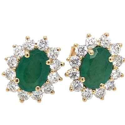 Lot 1054 - A pair of oval emerald and round brilliant-cut...