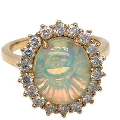 Lot 1058 - A 9ct hallmarked yellow gold opal and diamond...