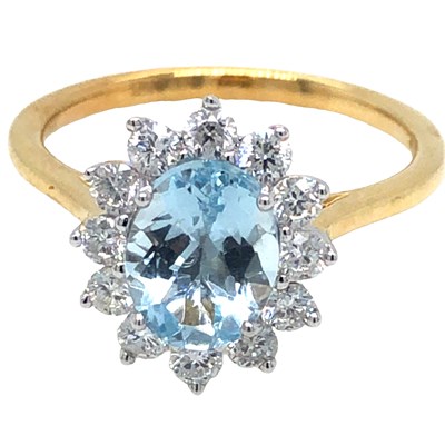 Lot 1059 - A hallmarked 18ct white gold oval aquamarine...