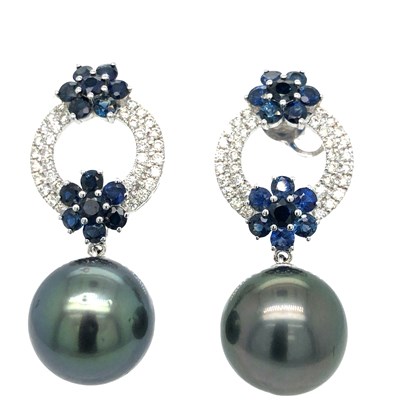 Lot 1053 - A pair of sapphire and diamond fancy...