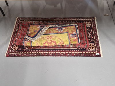 Lot 787 - A Chinese and two middle eastern rugs