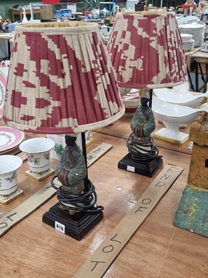 Lot 816 - A pair of Nubiam figural table lamps