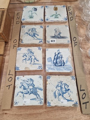 Lot 823 - Eight 18th century Delft tiles, four painted...