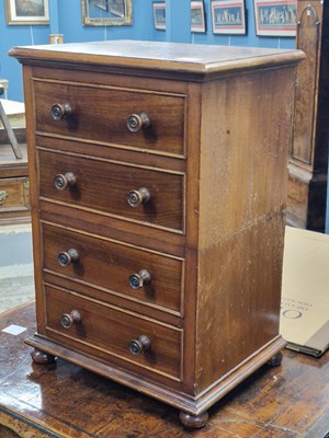 Lot 1551 - A mahogany collector's chest of four drawers. ...