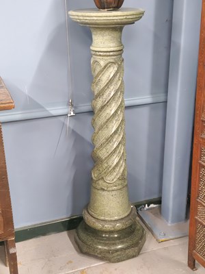 Lot 1572 - A mottled green stone column with the circular...