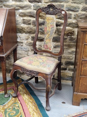 Lot 1576 - A pair of 18th century German walnut chairs,...