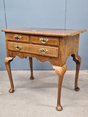 Lot 1593 - An 18th century walnut lowboy, the...