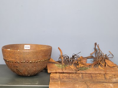 Lot 1596 - An African wooden bowl with hammered nail...