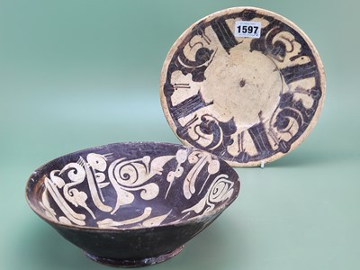 Lot 1597 - Two Nishapur type bowls, one geometrically...