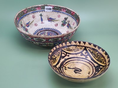 Lot 1598 - A Middle Eastern pottery bowl decorated in...