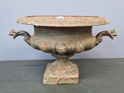 Lot 1605 - An iron two handled urn, the everted rim over...