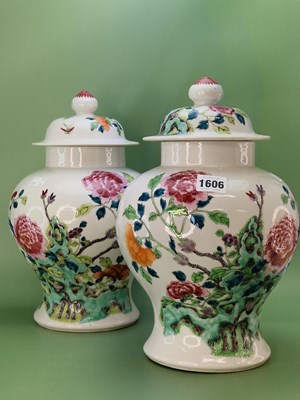 Lot 1606 - A pair of Chinese famille rose baluster jars...