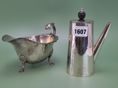 Lot 1607 - A silver tripod sauce boat by Deakins,...