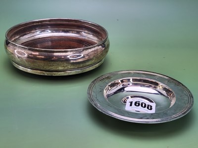 Lot 1608 - A silver rimmed wine coaster by Broadway & Co.,...