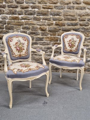 Lot 1632 - A pair of white painted fauteuils, the backs...