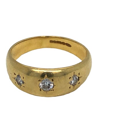 Lot 1002 - An 18ct hallmarked gold and diamond three...
