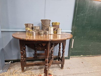 Lot 1638 - An 18th century oak oval flap top table with a...