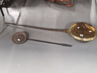 Lot 863 - A brass bed pan with an iron handle together...