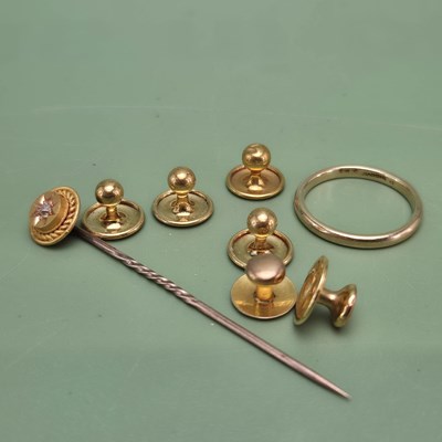 Lot 1045 - A group of six various gold buttons, three...