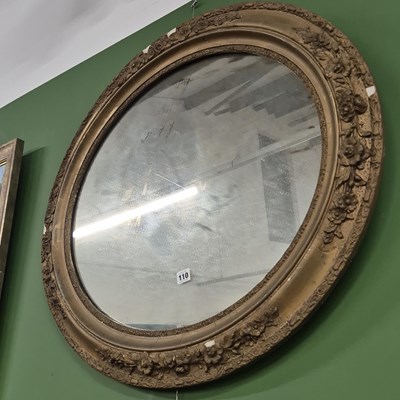 Lot 110 - An antique oval wall mirror. 83 x 72cm.