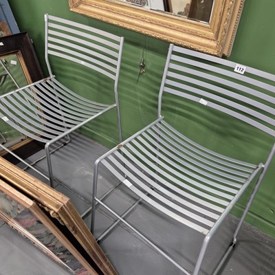 Lot 112 - A pair of modern iron chairs.