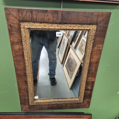 Lot 146 - A walnut framed wall mirror. 50 x 68cm