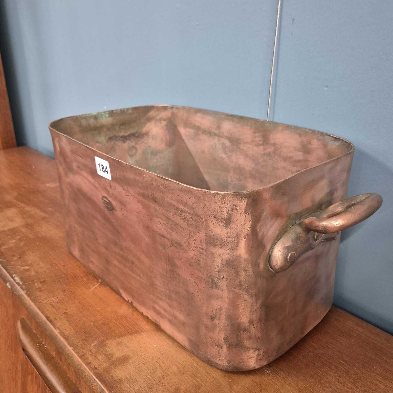 Lot 184 - A large, deep copper cooking pan. H 22 W 52