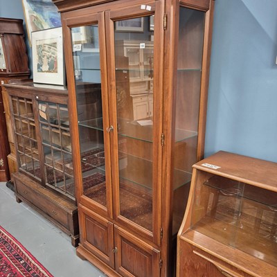 Lot 185 - A tall modern glazed display cabinet. H 196 W...