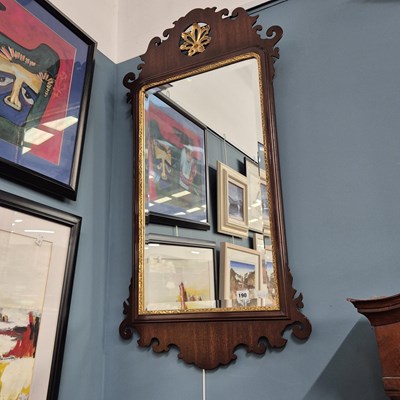 Lot 190 - An antique fret framed wall mirror.