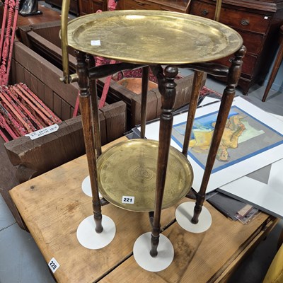Lot 221 - A folding cake stand with brass trays