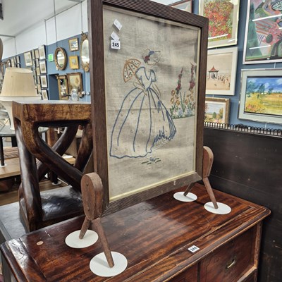Lot 245 - A fire screen. H 76 W 56 D 18cm.