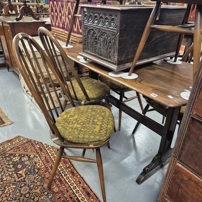 Lot 246 - An Ercol dining table and six high back chairs....