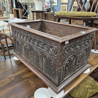 Lot 247 - A 19th century carved oak log box with earlier...