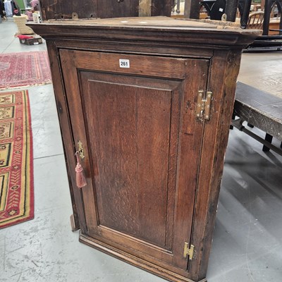 Lot 261 - A Georgian oak corner cabinet. H 94cm
