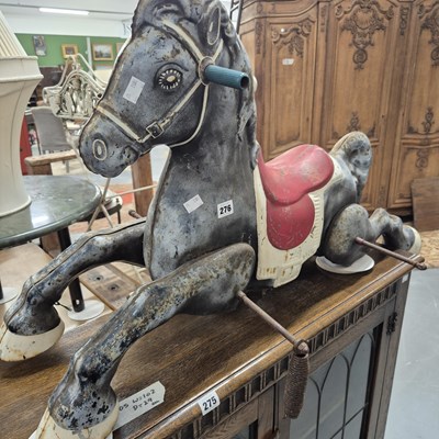 Lot 276 - A vintage tin rocking horse, probably by MOBO