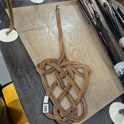 Lot 288 - A carpet beater.