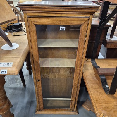 Lot 290 - A small oak display cabinet with single glazed...